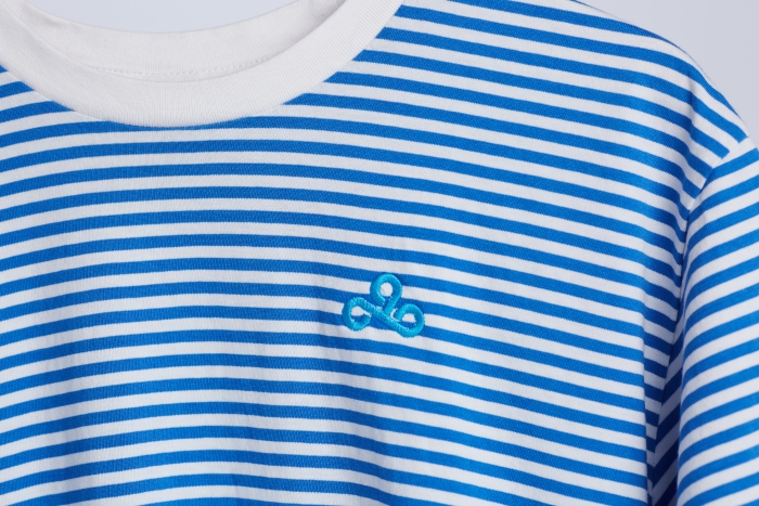 Close up of Cloud 9 logo on a blue stripped t-shirt