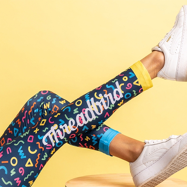 Custom sublimated leggings with Threadbird printing and different colored cuffs