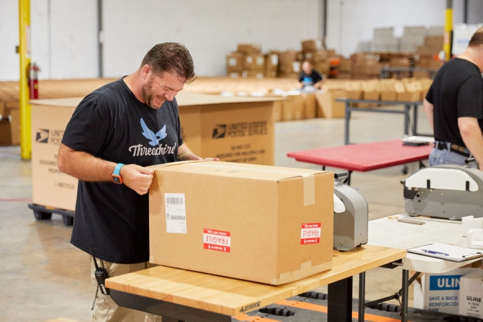 Threadbird packaging in fulfillment warehouse